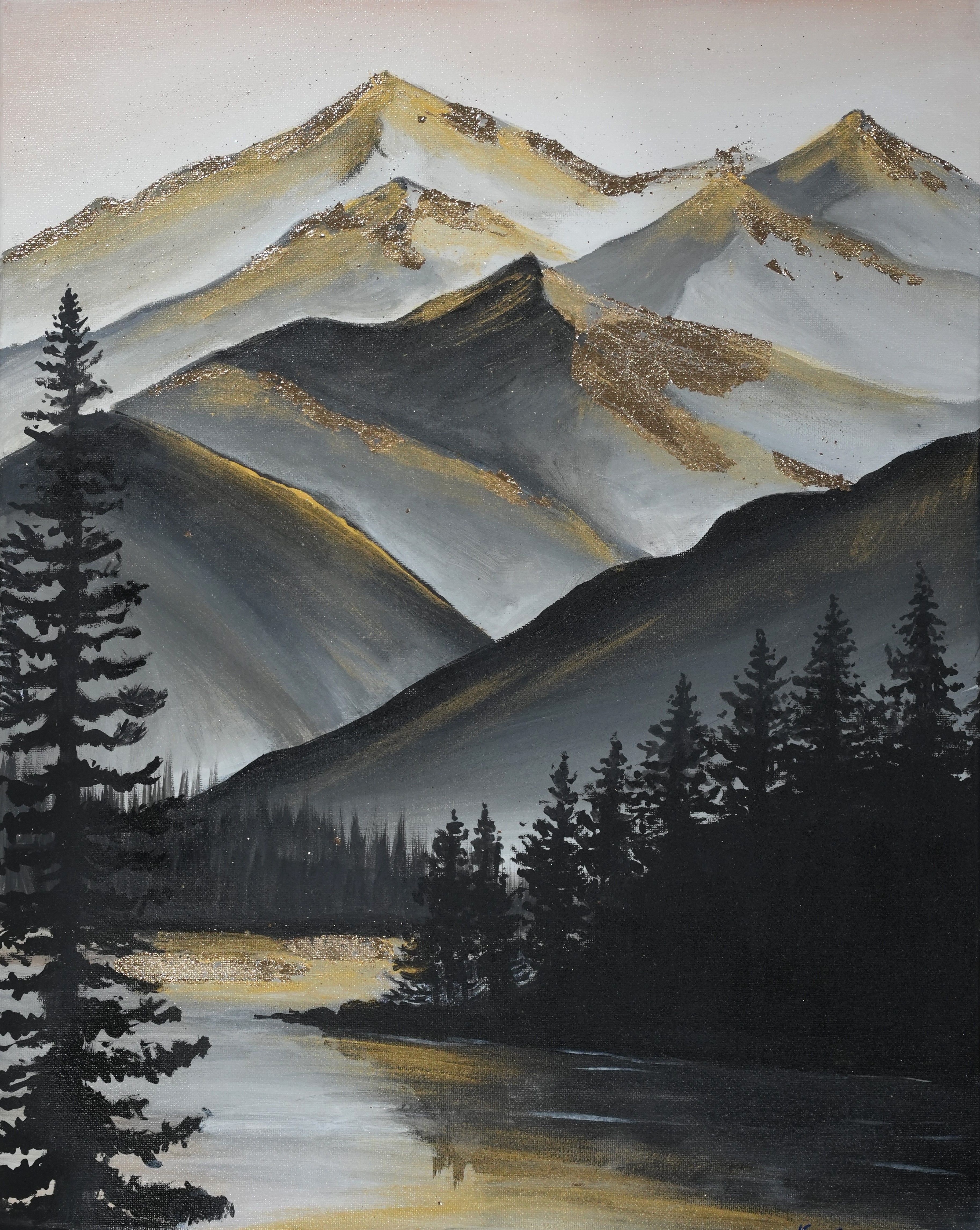 Layered gray mountain peaks with golden light and dark pine silhouettes.